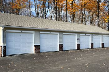 A row of garages with white garage doors